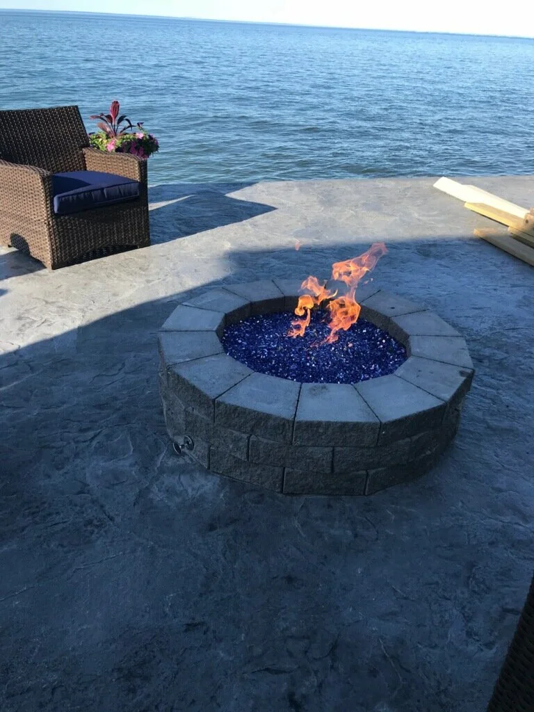 stamped concrete patio with fire pit on Stone Decorative Fire Pits Fireplaces Somerset Patios Concrete Stamped Concrete Patios Driveways Rochester Ny