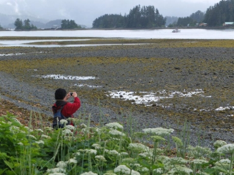 Tourist snaps a picture outside Totem Park. 