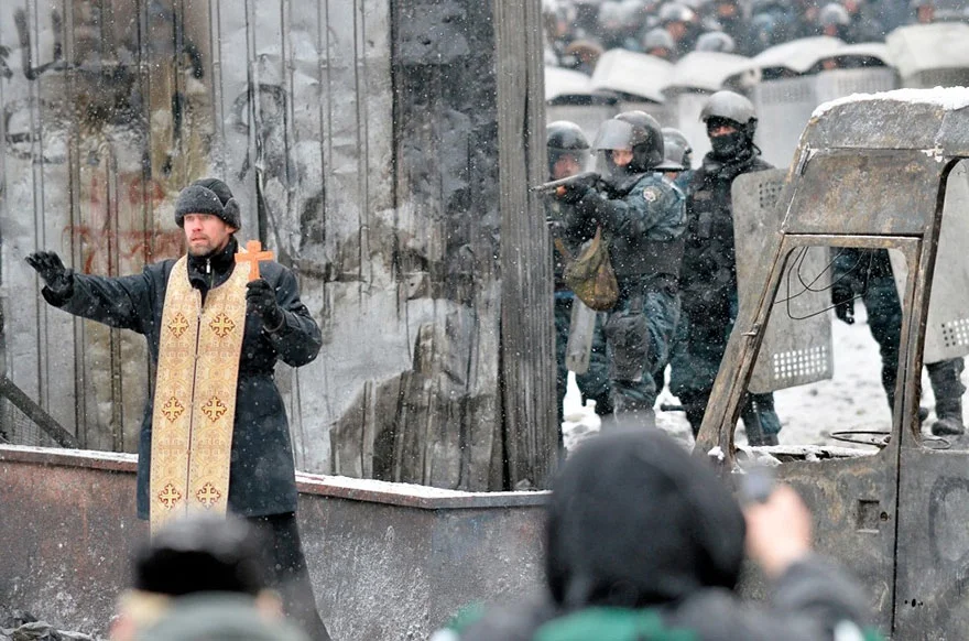 priest between violence.jpg