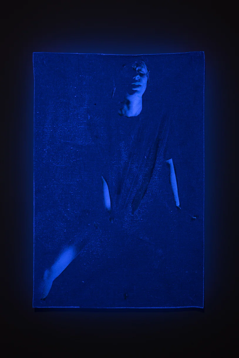 Piss factory , 2016- 17. Pigment print on canvas, glow in the dark latex paint, and ultraviolet light; 14 x 9.5 inches.
