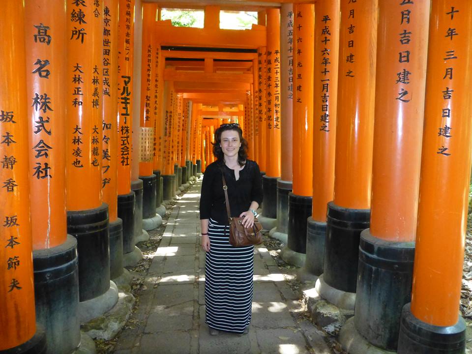Natalie exploring the endless orange torii of the Fushimi Inari shine, Kyoto, Japan