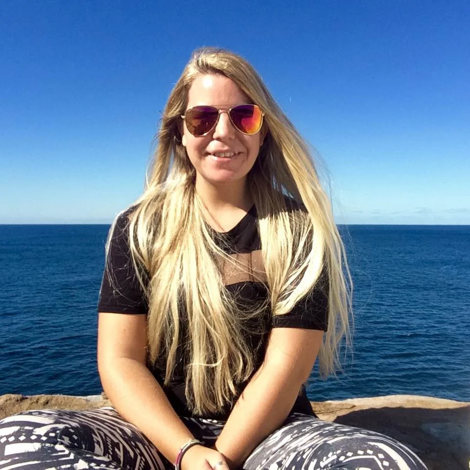 Toni at her favourite place in the world, the Bondai to Coogee coastal walk in Sydney, Australia