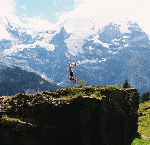 Ruby practising handstands, taking in the majestical views at Lauterbrunnen, Switzerland