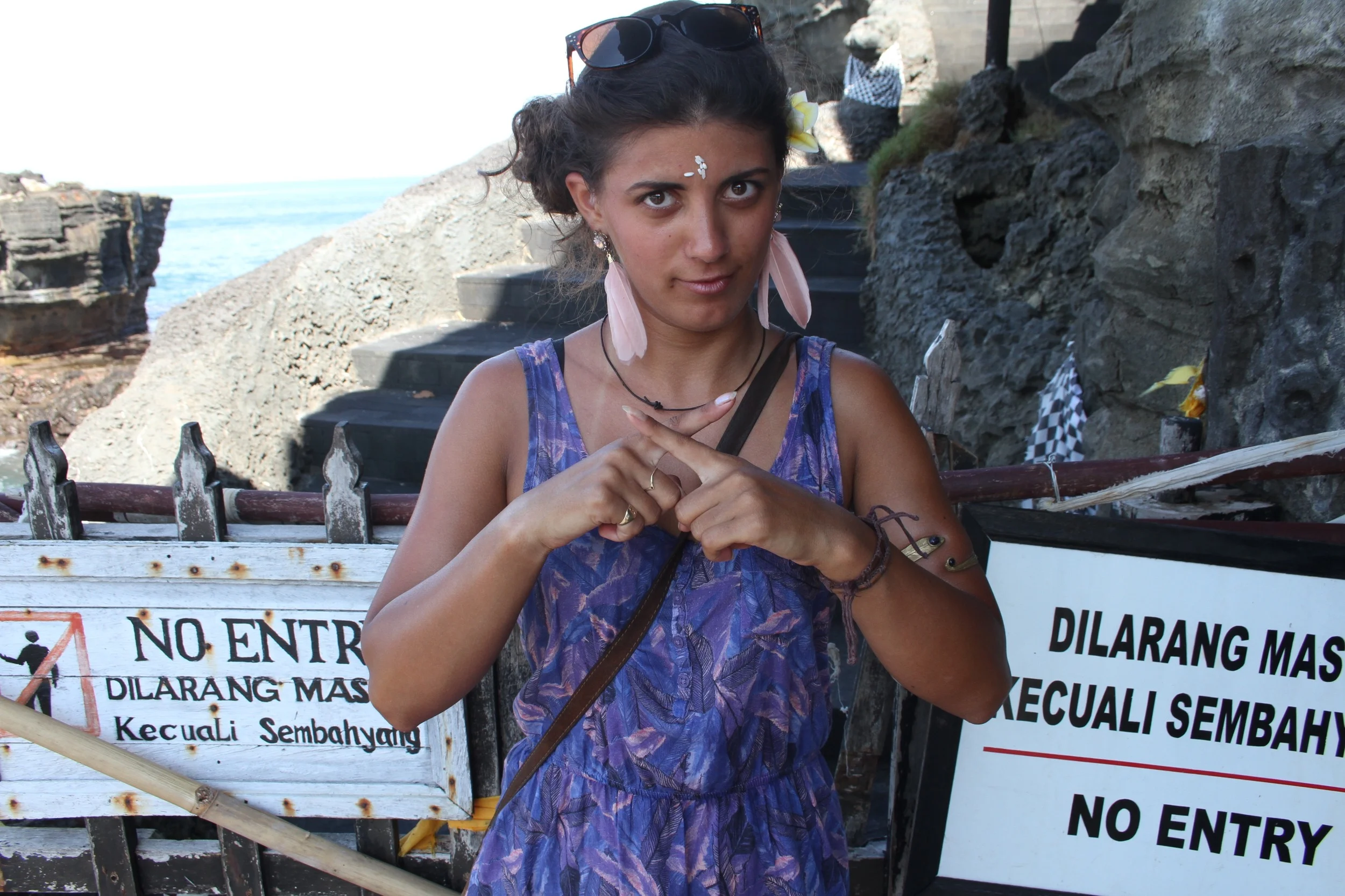 Dilara in Tanah Lot, Bali, Indonesia (the reason for the hand symbol? Dilarang = forbidden in Indonesian)