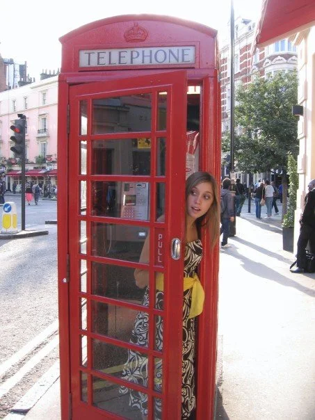 Olivia analysing just how practical red telephone boxes in London, UK actually are.