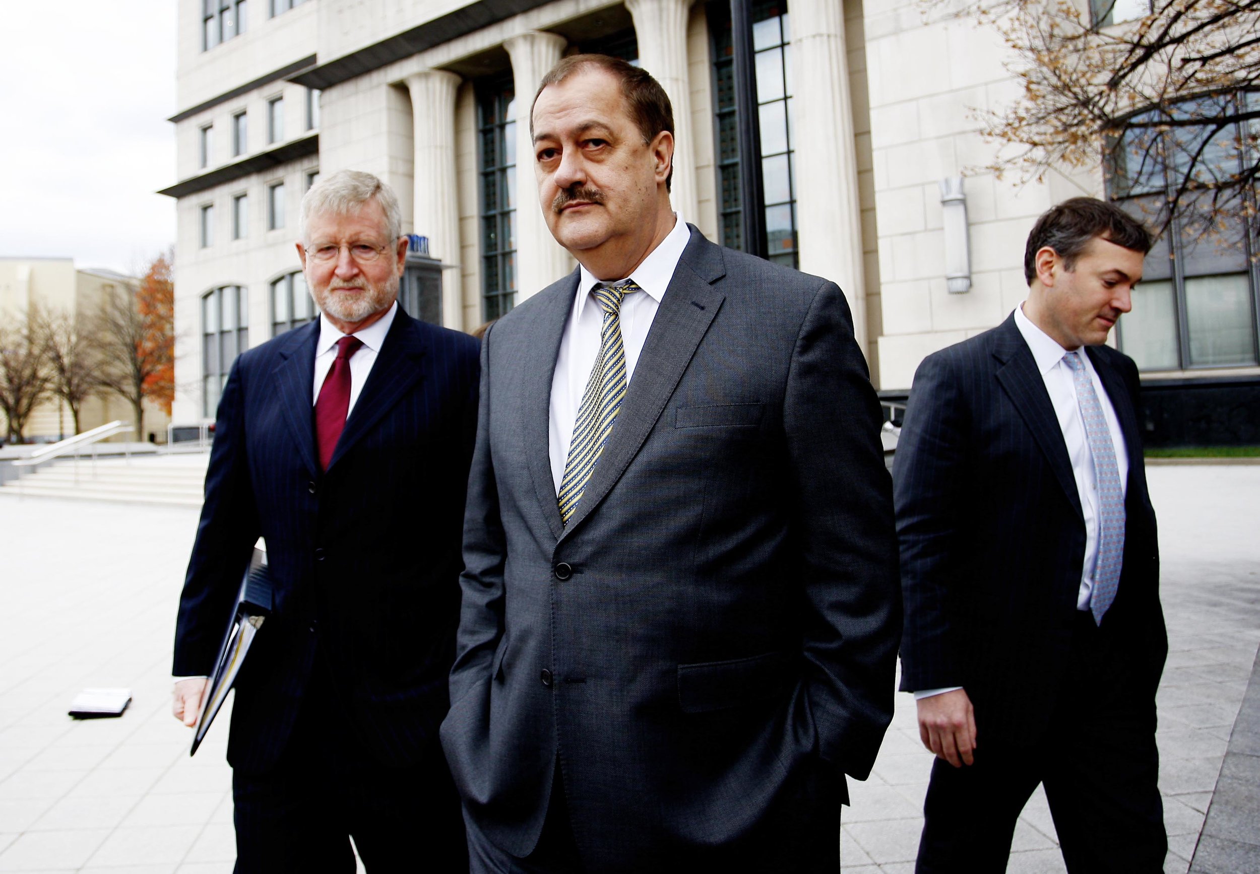 Donald 'Don' Blankenship, former chief executive officer of Massey Energy Co., center, and his attorney Bill Taylor, left, exit the Robert C. Byrd U.S. Courthouse in Charleston, West Virginia, U.S., on Thursday, Dec. 3, 2015. Blankenship, one of Appalachias last coal barons, was found guilty of plotting to speed up production by ignoring safety rules at a company mine that later blew up killing 29 workers.