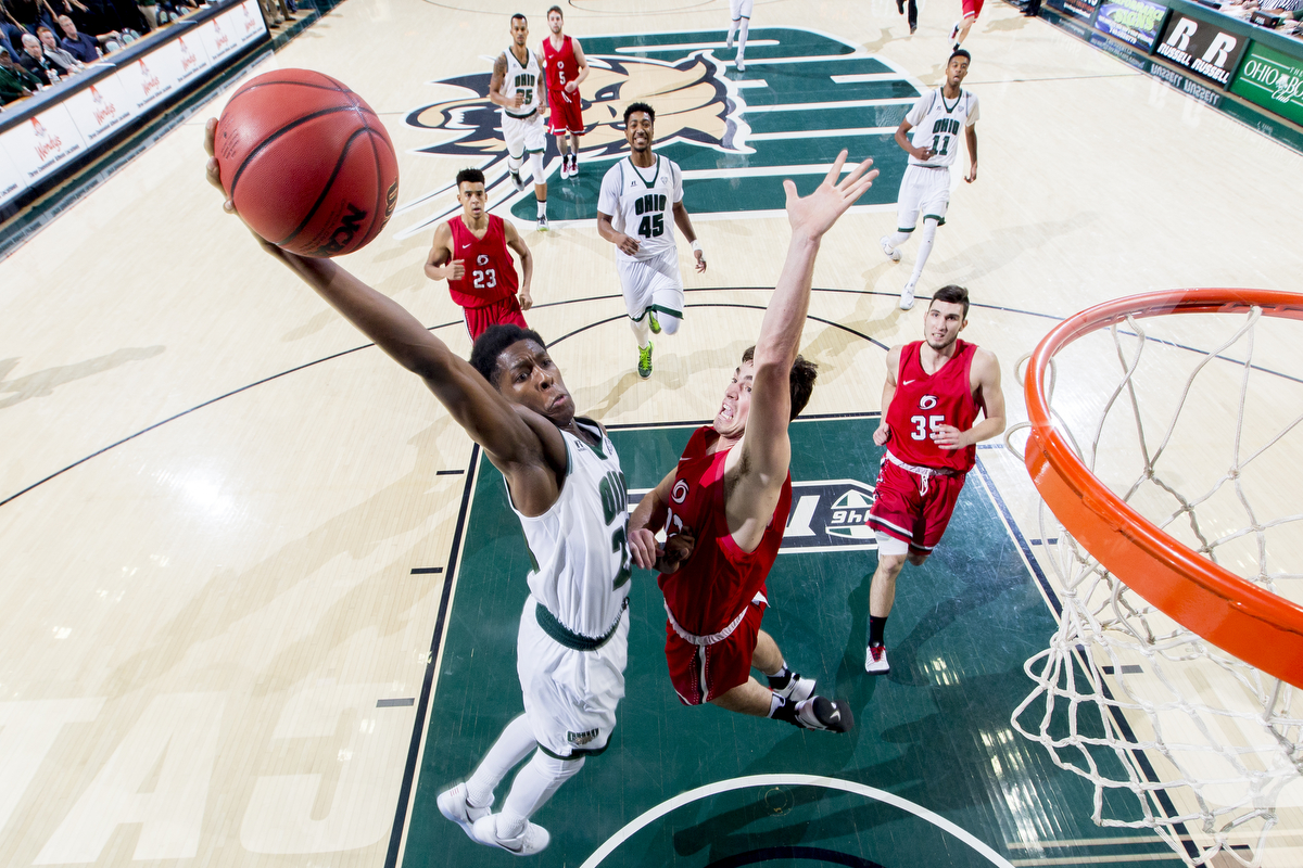  Ohio Bobcats’ Rodney Culver (23) goes for a dunk past Rio Grande's Kaileb Sheets (12) at the Convocation Center in Athens, Ohio. 