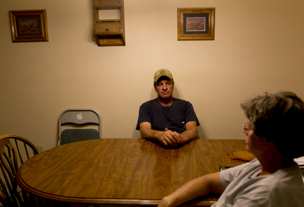  Paul Southall relaxes with his wife Rhonda in the kitchen after a long day of work. 