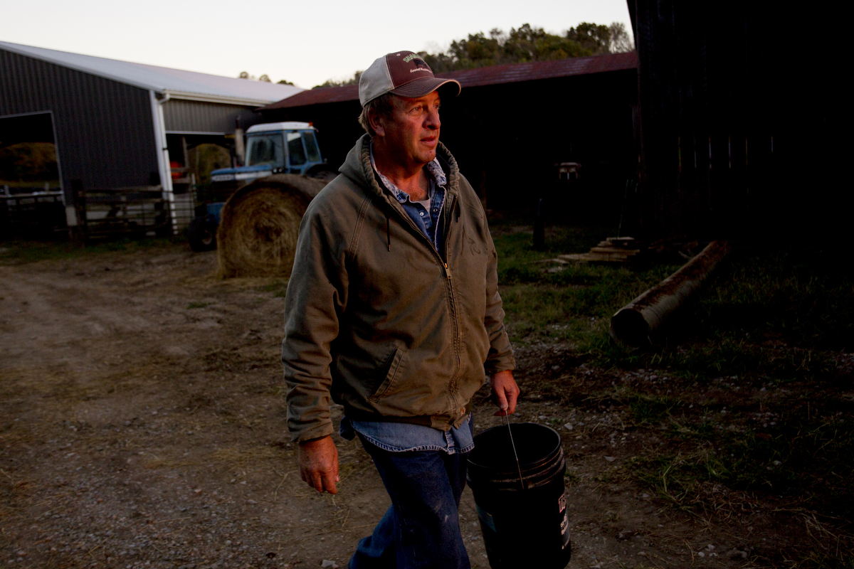  Paul Southall does early morning chores on his farm in rural Homer Township, Ohio.&nbsp; 