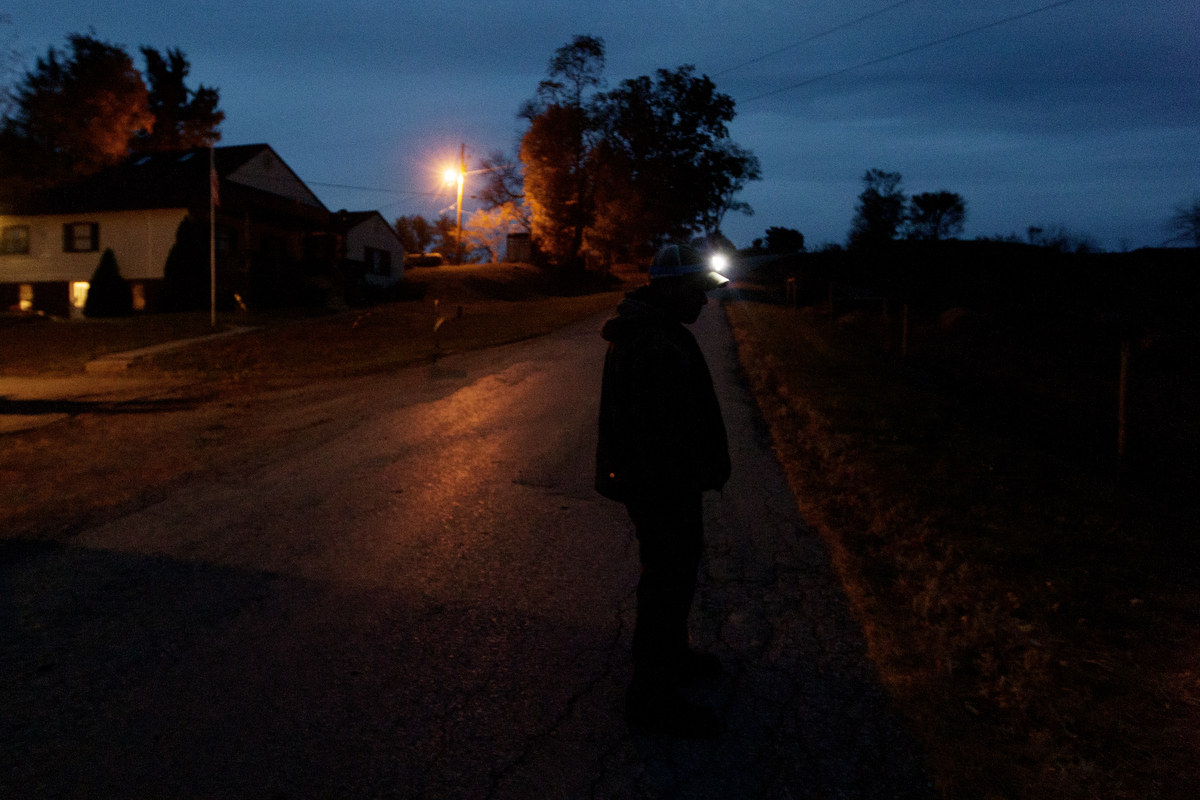  Reitano looks off into the distance during nightfall after completing his evening chores.&nbsp; 