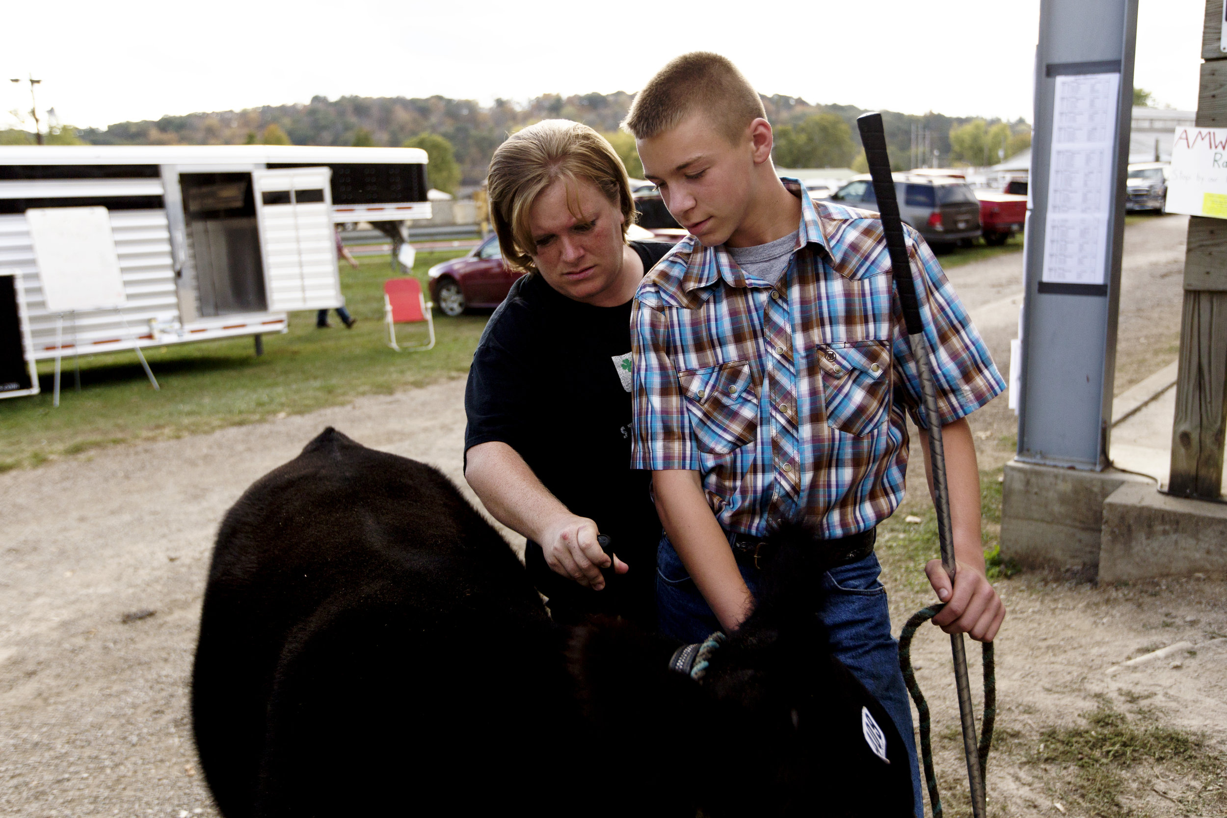  Braden and his mother Sheila look over the steer one last time before showing it for market. 