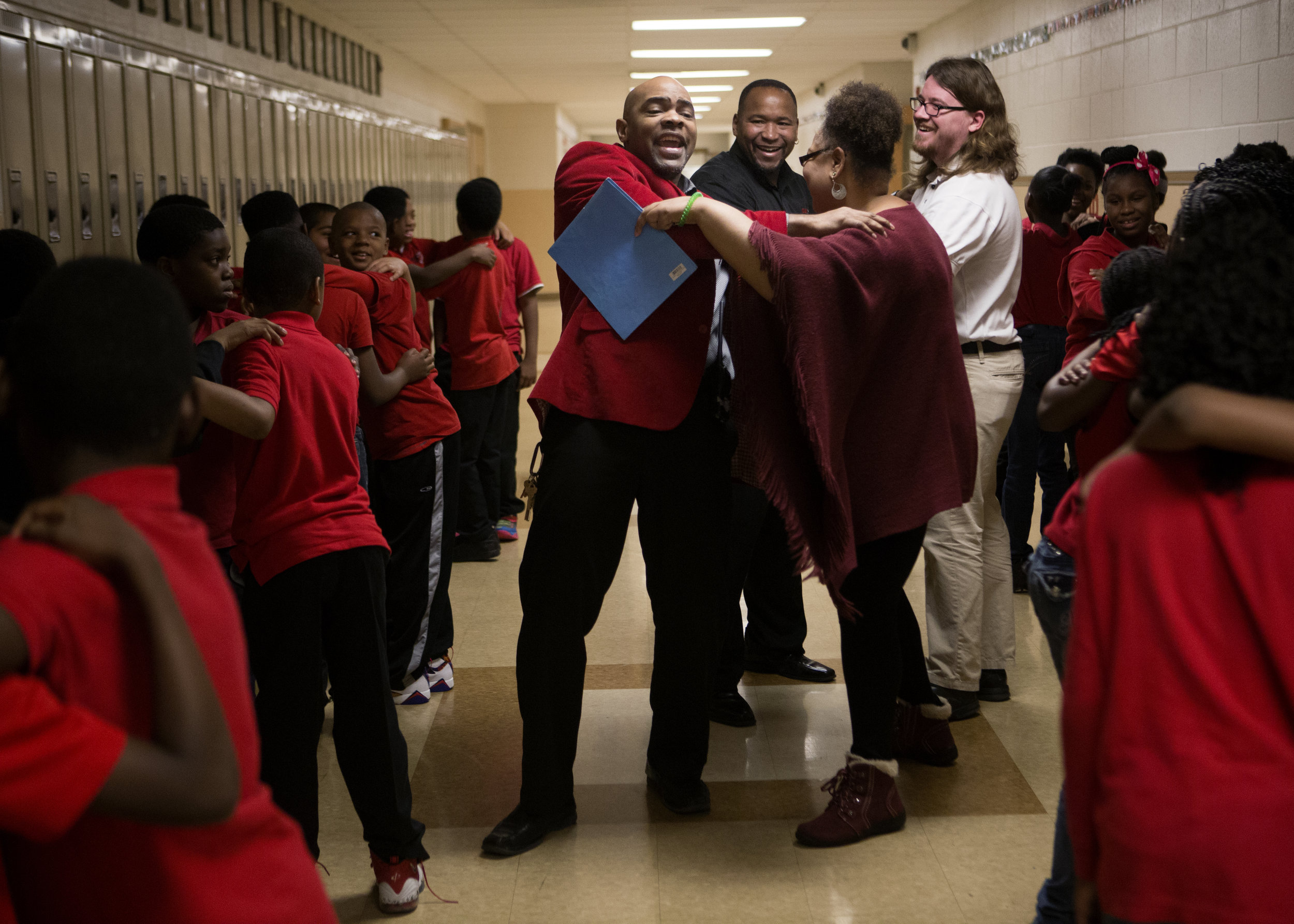  Clarke Street School Principal Daryl D. Burns shows 4th and 5th graders how to play "booty bump," a game focused on building teamwork. 