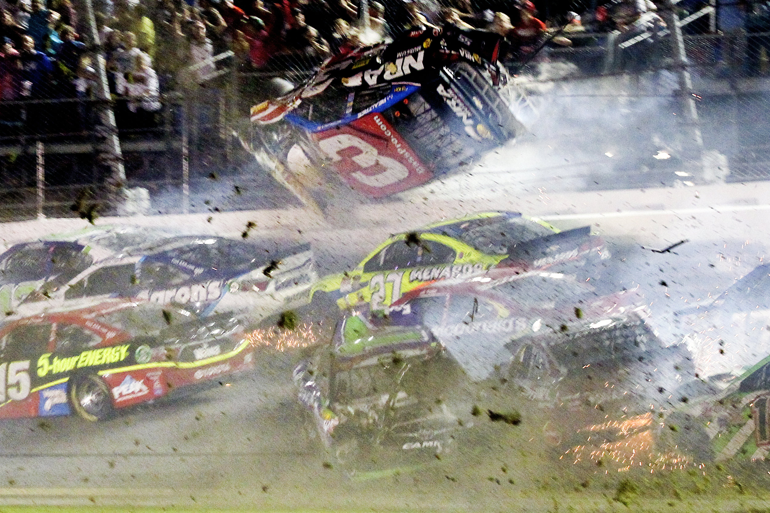  Austin Dillon (3) goes airborne upside down in a crash on turn one after the final lap during the Coke Zero 400 NASCAR Sprint Cup race at Daytona International Speedway in Daytona Beach, Florida. 