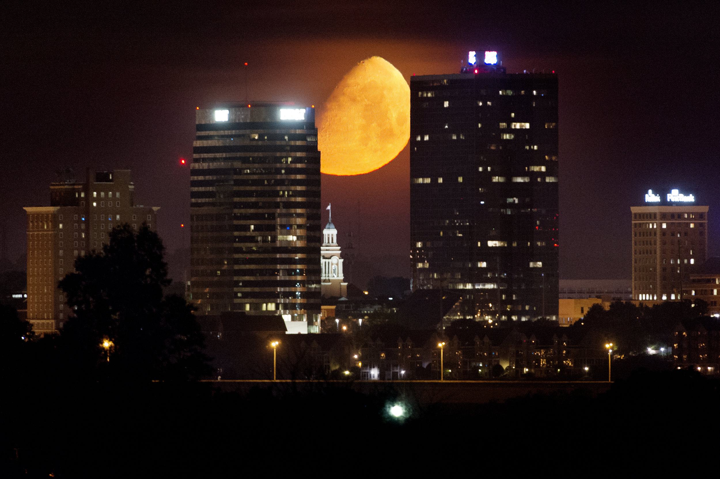  A waxing gibbous moon sets over the downtown Knoxville skyline leading up to the June 9 Strawberry Moon in Knoxville, Tennessee on Saturday, June 3, 2017. The Strawberry Moon, also referred to as a minimoon, is this year’s smallest full moon orbitin