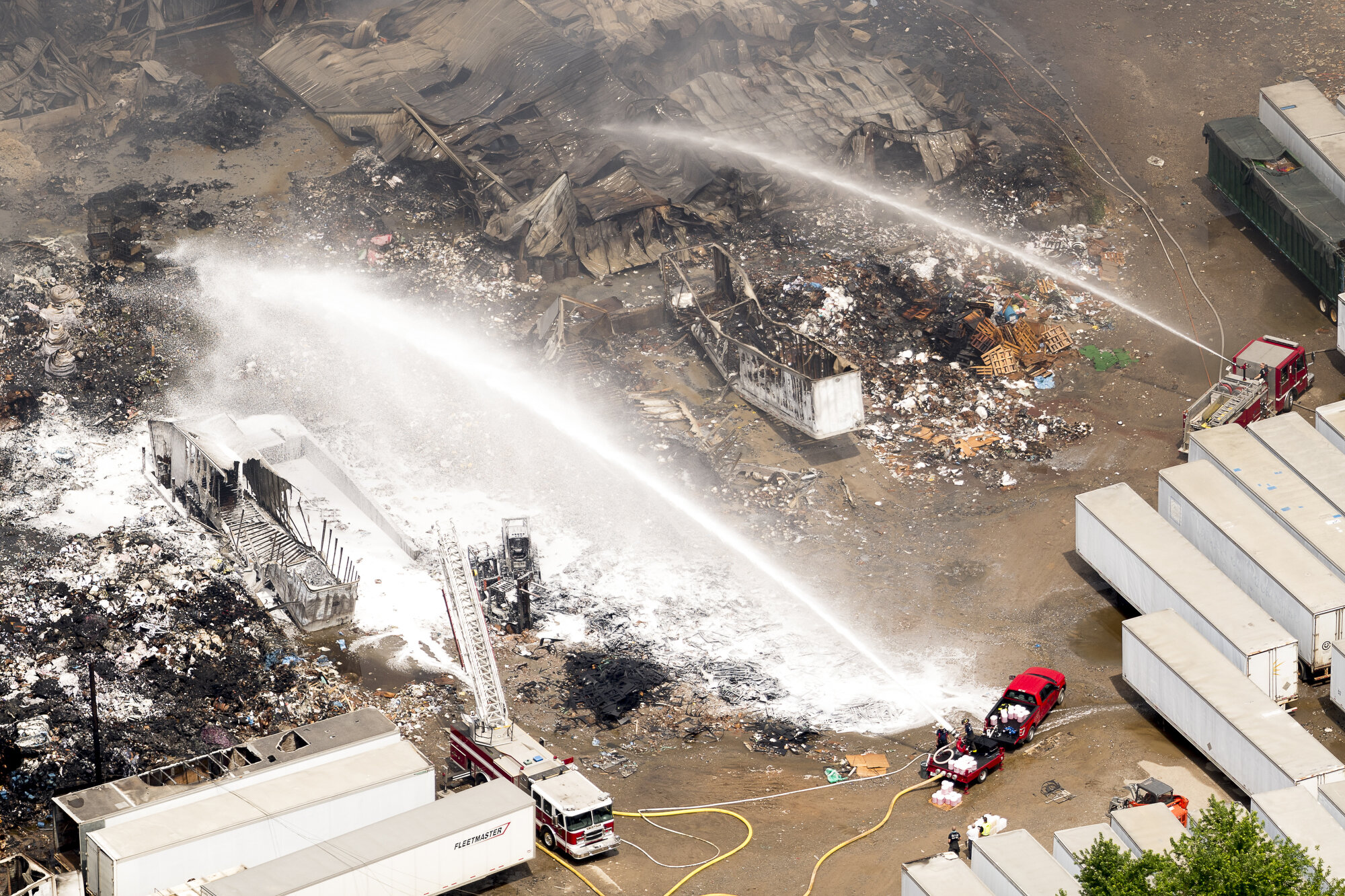  Firefighters spray a fire retardant foam onto a fire at Fort Loudon Waste &amp; Recycling as seen in this aerial photograph taken from an airplane in Knoxville. 
