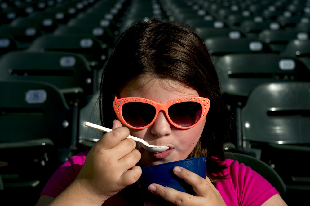  Makayla Graham, 9, of Clinton, enjoys an ice cream during a game between the Tennessee Smokies and Montgomery Biscuits at Smokies Stadium in Kodak, Tenn. 