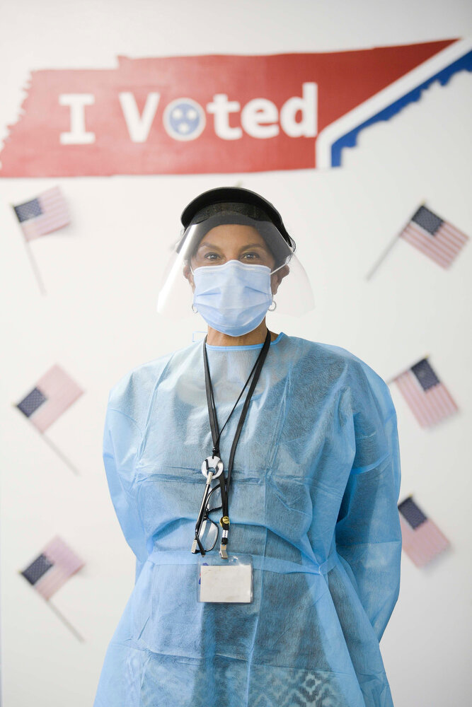 Poll worker Josephine Jones poses for a portrait in her full protective gear including smock, facemask and face shield during early voting at The Love Kitchen on MLK Drive in Knoxville, Tenn. 