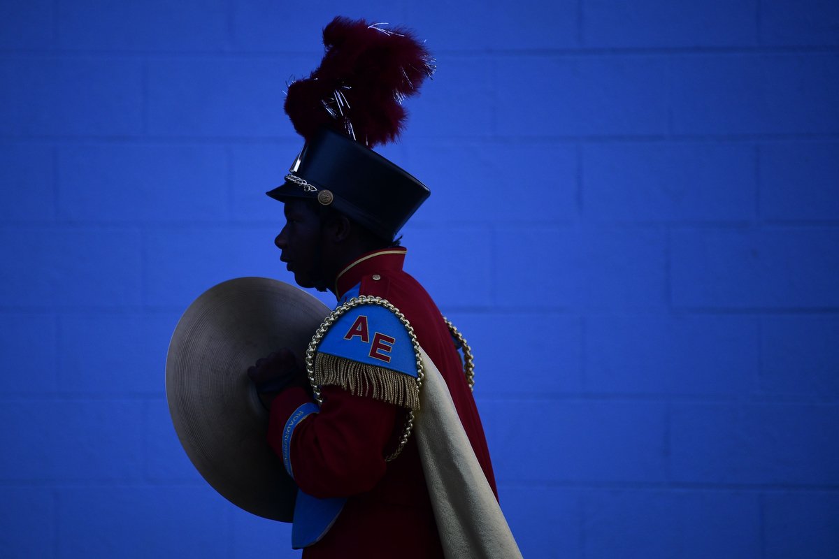  An Austin-East Marching Band member marches to the stadium before a football game in Knoxville. 