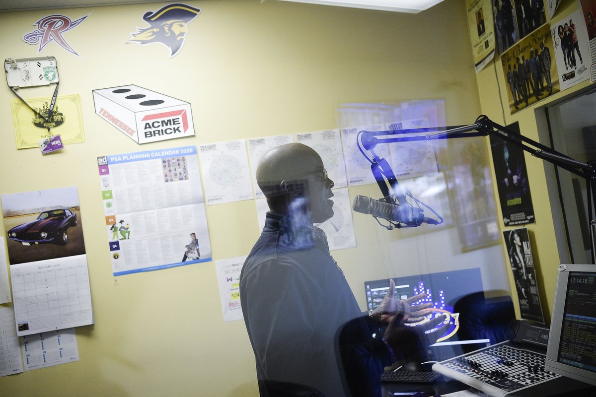  Program Director Gene Thomas speaks into the microphone in his booth at the WJBE 99.7 radio station offices in Five Points in Knoxville. WJBE is the city’s only Black-owned radio station and was founded by singer James Brown in the 1960’s. 