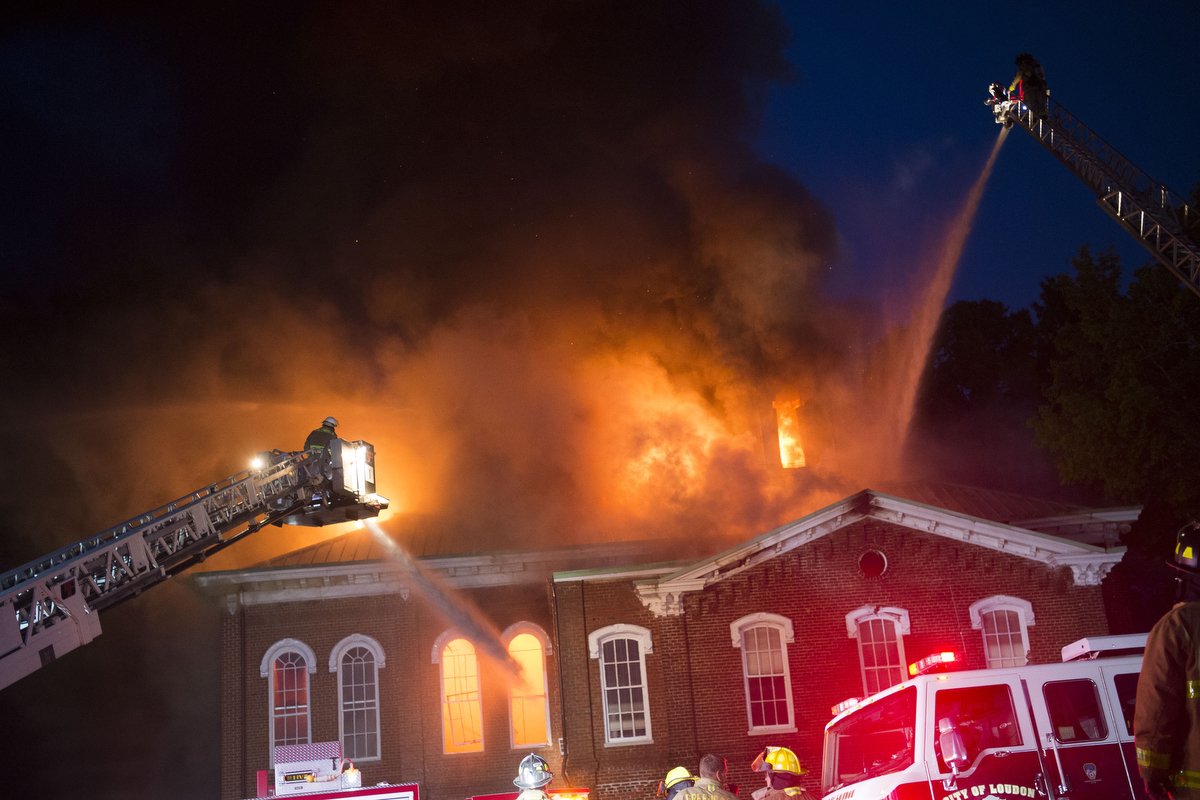  Firefighters douse the flames with water from ladder trucks at a fire at the Loudon County Courthouse in Loudon, Tennessee on Tuesday, April 23, 2019. The building, which was built in the 1870's and listed on the National Register of Historic Places