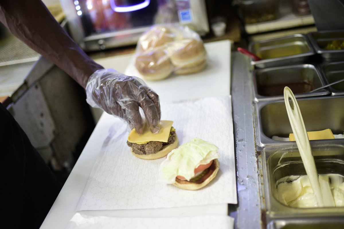  Building the perfect burger is an art form to Andre Bryant, who believes every condiment should be tasted in every bite. Each burger ordered at the Burger Boys drive-thru comes with the restaurant's signature "free fries," which are hand-cut, hand-s