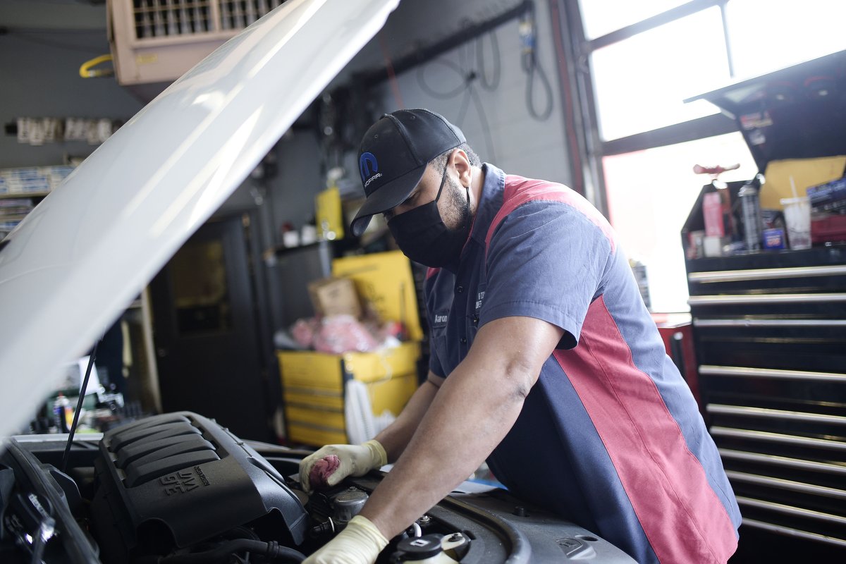 Aaron Brown works on a vehicle at Mr. Cool's. The elder Brown hopes the world will become a more equal one during his children’s lifetime. In the meantime, he’s doing what he can to set up his family for success. “It will feel good knowing you can t