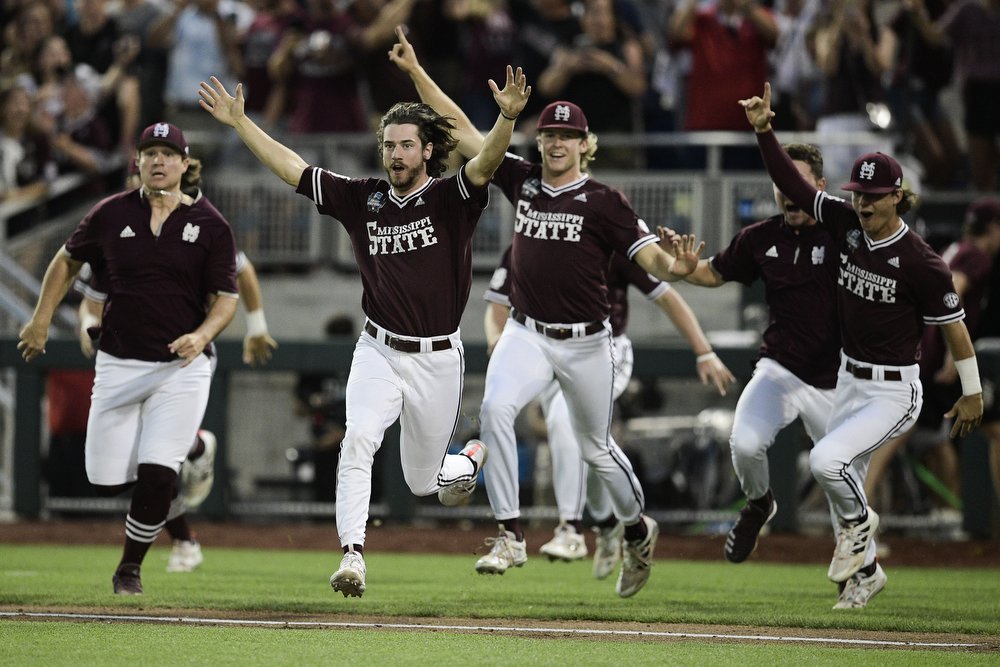  Mississippi State players rush the field in celebration after defeating Vanderbilt 9-0 in Game 3 of the College World Series finals at TD Ameritrade Park in Omaha, Neb. on Wednesday, June 30, 2021. 
