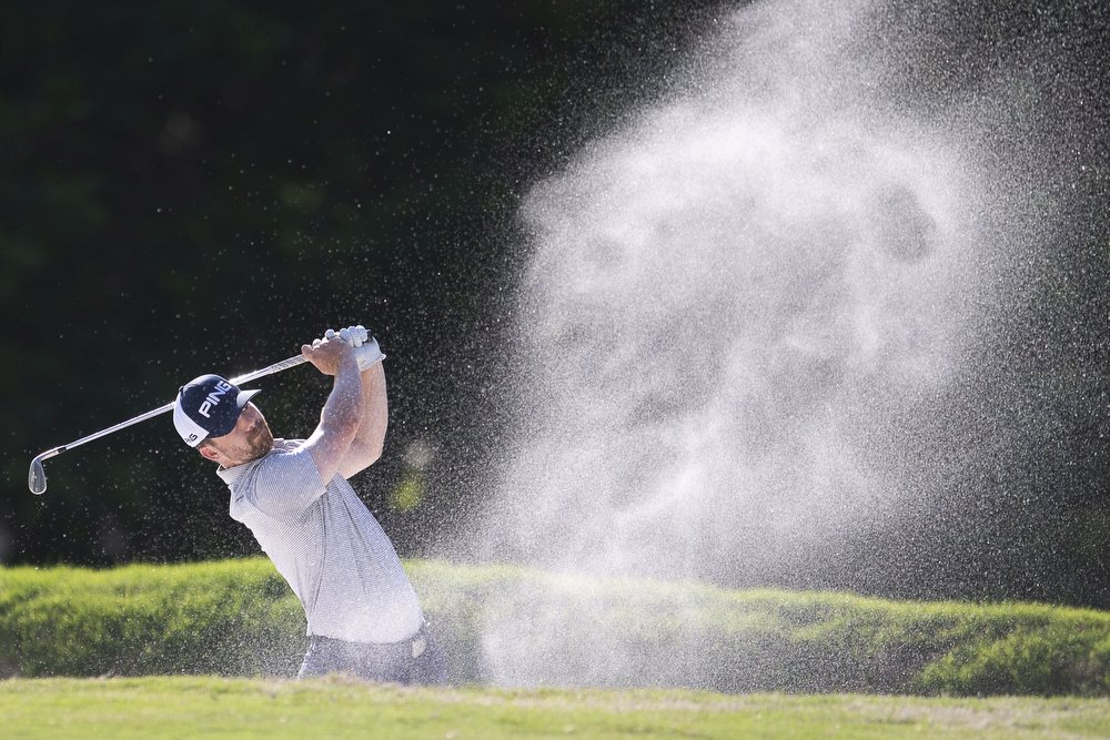  Wade Boteler hits from the bunker during the first round of play at the Knoxville Open at Fox Den Country Club in Farragut, Tennessee on Thursday, May 10, 2018. 
