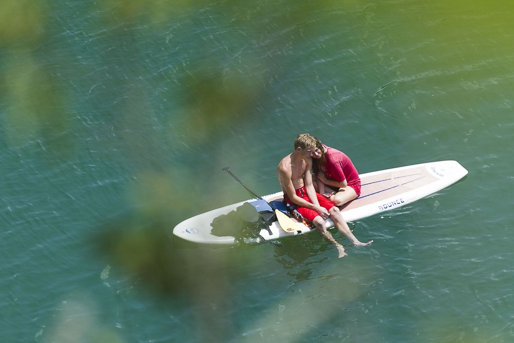  A couple enjoys a moment together on their paddle board at Mead's Quarry at Ijams Nature Center in Knoxville. 