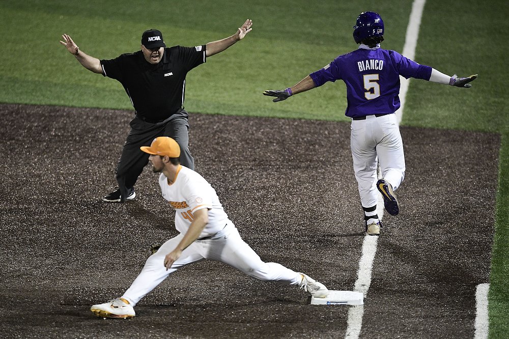  LSU's Drew Bianco (5) is safe at first as Tennessee's Luc Lipcius (40) tries to out him at the NCAA Baseball Knoxville Super Regionals at Lindsey Nelson Stadium in Knoxville. 