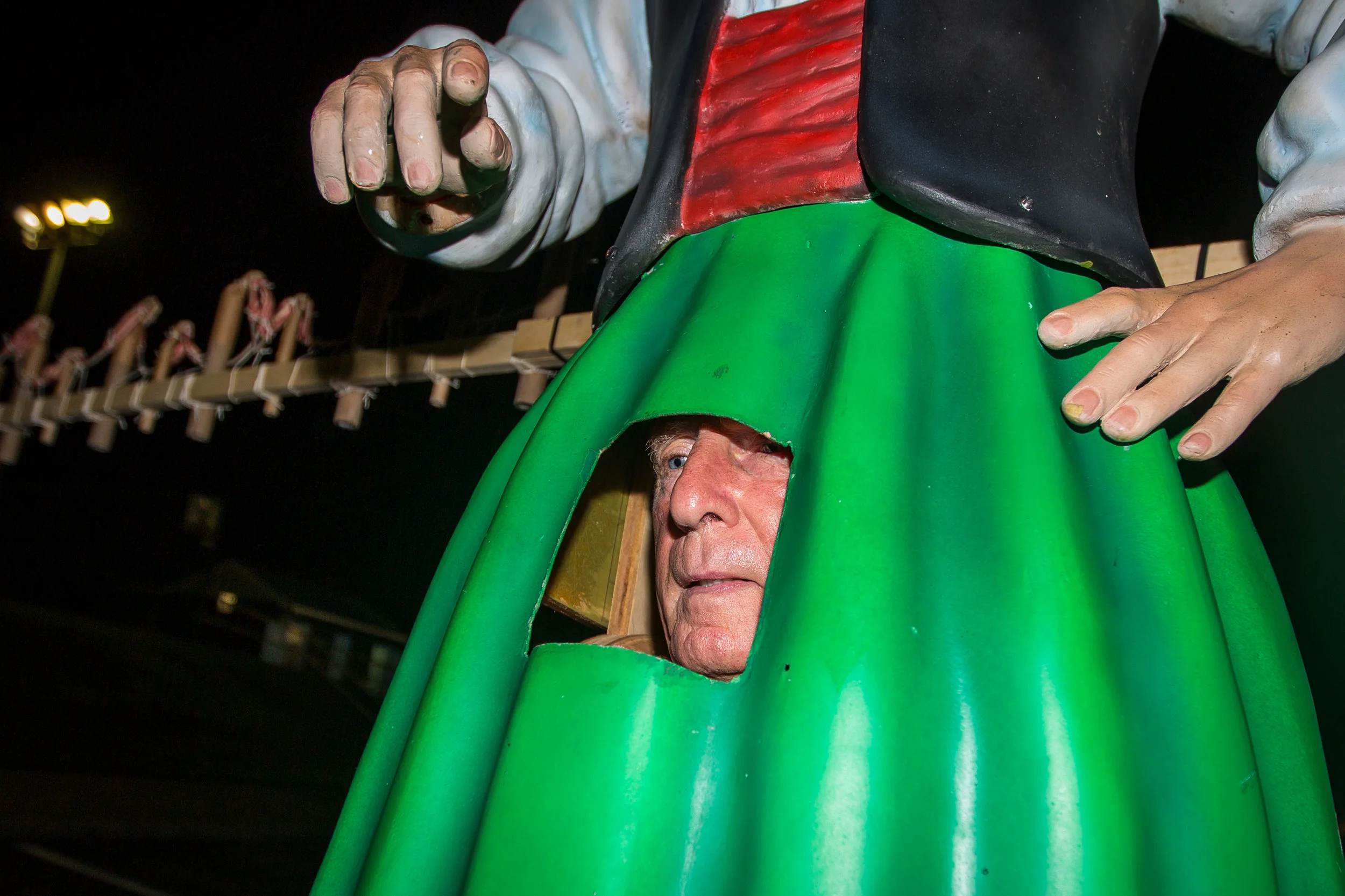 Henry Bufalini adjusts the Baby Doll costume after he put on the seven foot tall statue on Sunday night in Aliquippa. Henry has participated in the Baby Doll Dance since 1987.