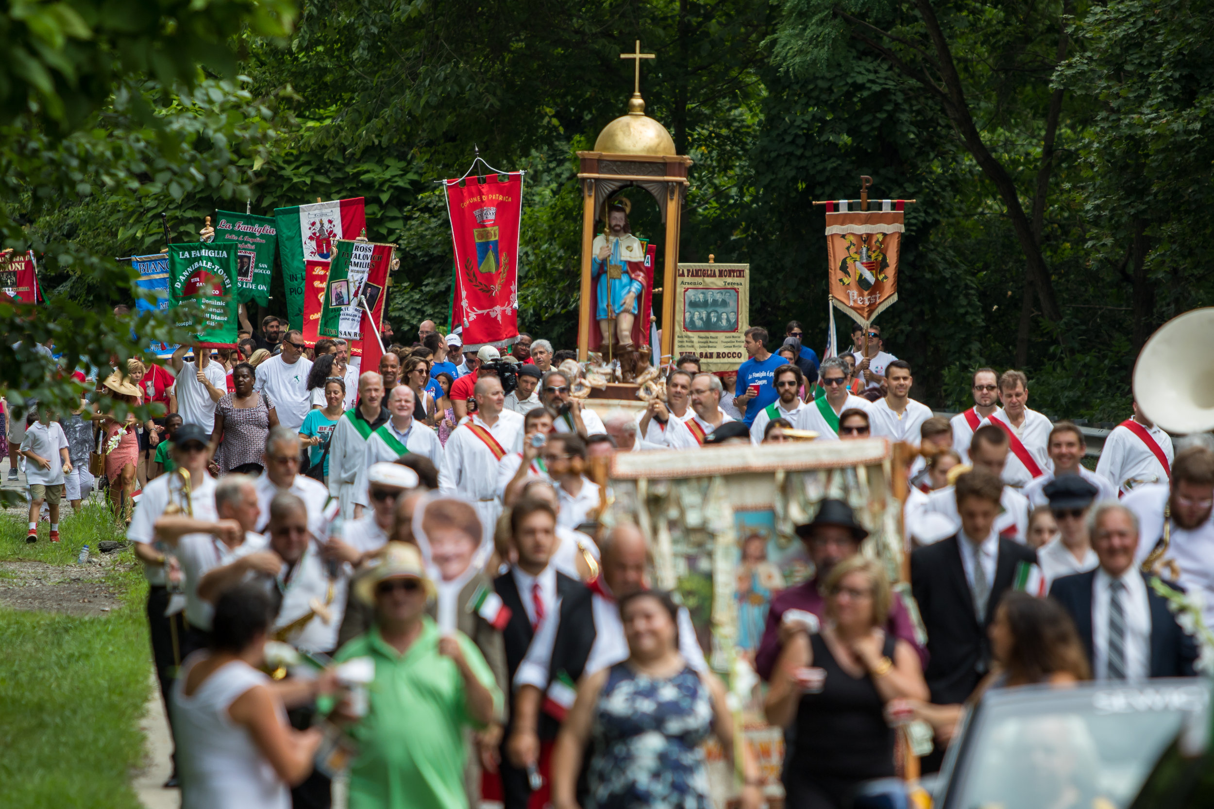  Thousands of people participated in the procession after the San Rocco Liturgy at St. Titus Church in Aliquippa on Sunday morning. The procession featured many families with family banners marching through the streets of Aliquippa with the San Rocco