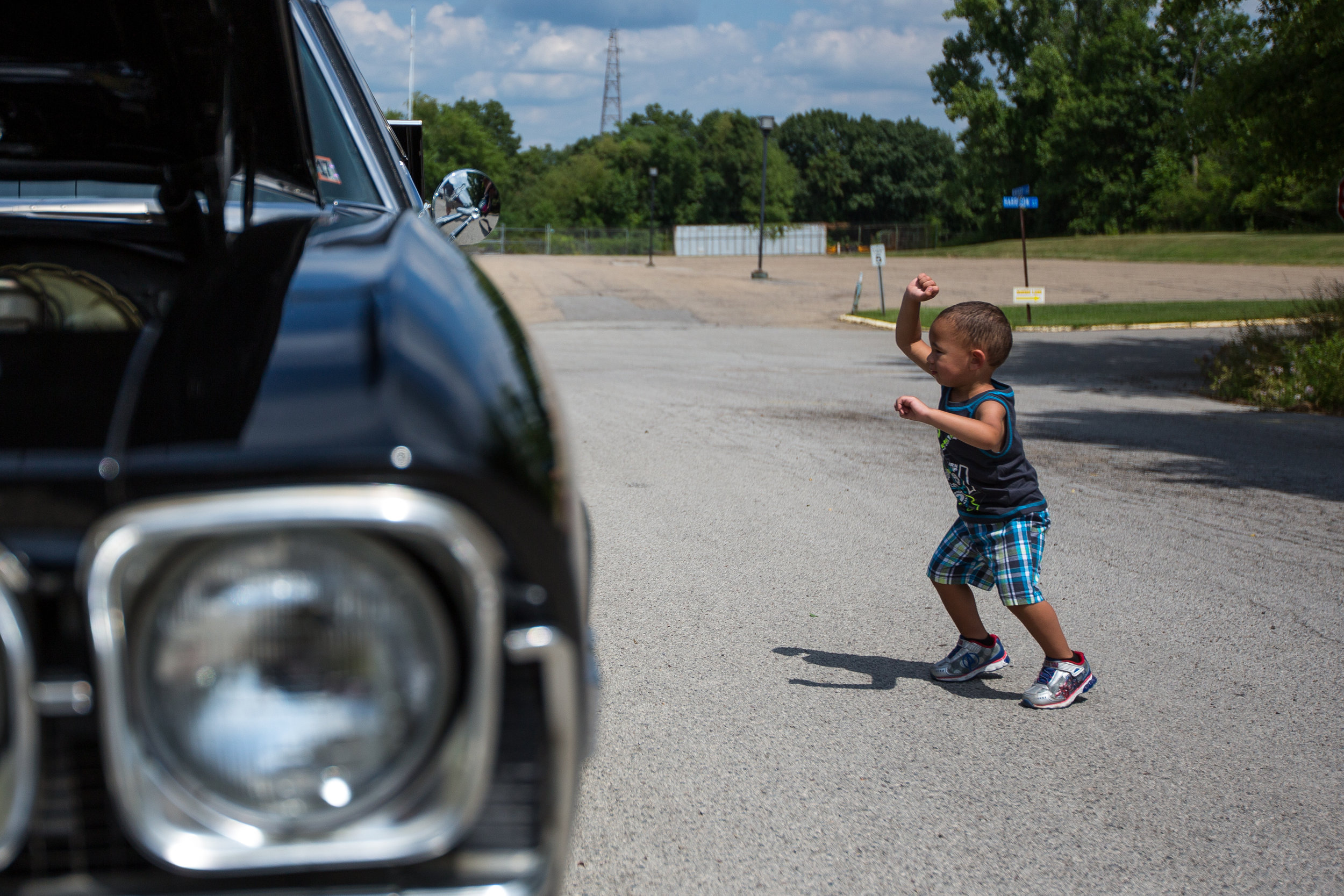  Joycean Thomas, 2, dances while looking at a car at the Rochester Fireman's Car Cruise on Saturday morning. The event had cars from all around the area, food vendors and an all day band.  