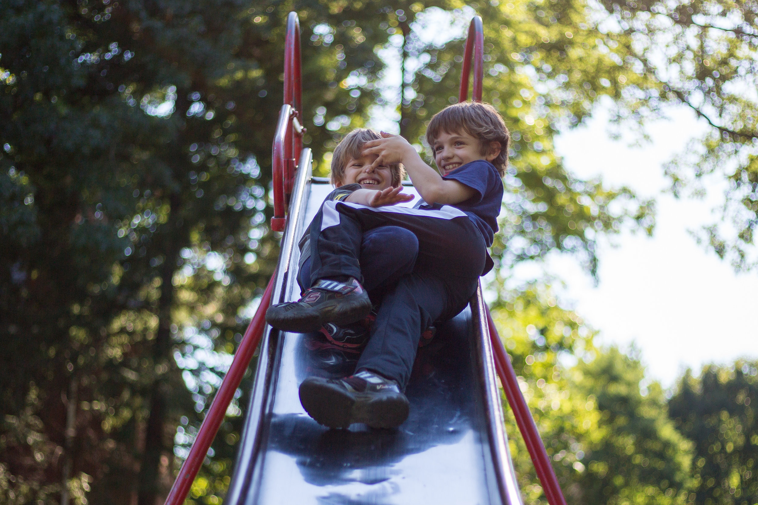  Gabriel Martella, 4, left and older brother Domynik, 8, play on the slide at Wayne Park in Beaver on Monday afternoon.  