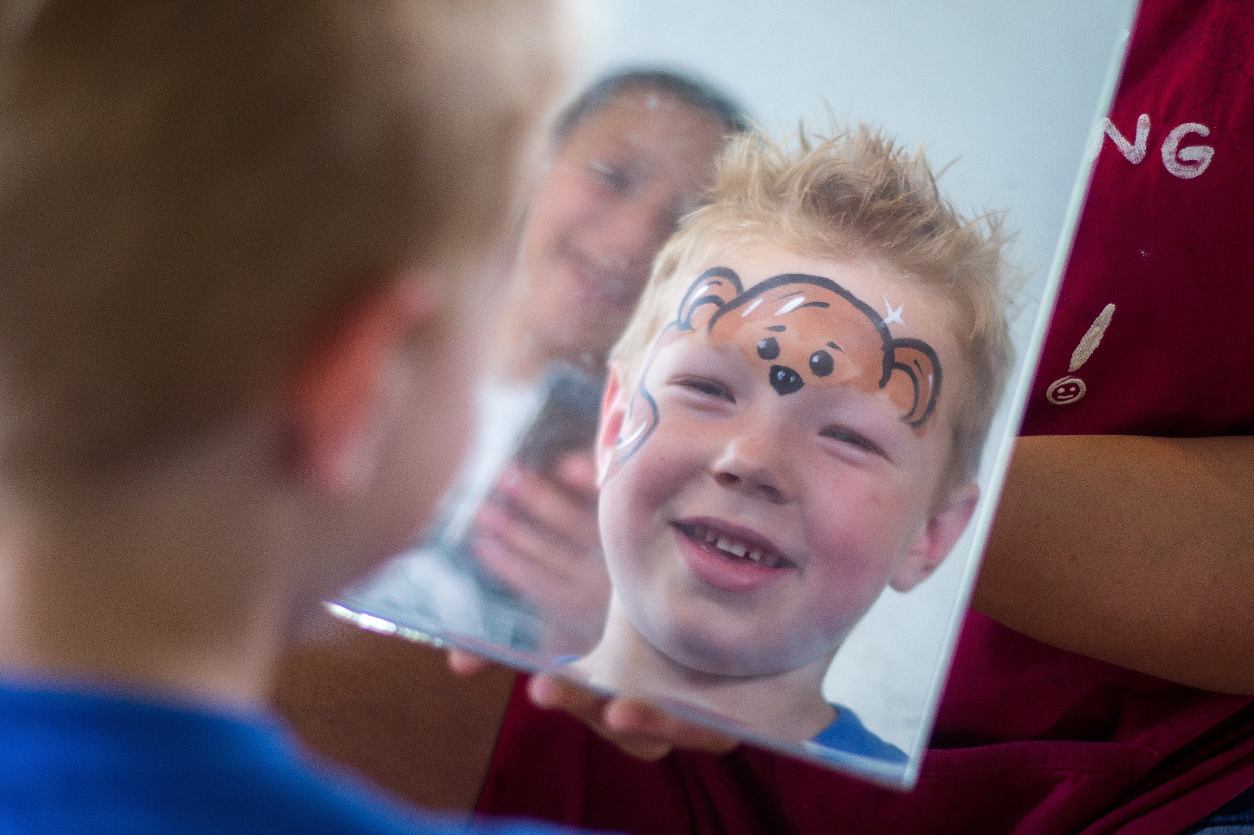  Jesse Shaffer, 7, of Darlington, smiles as he sees his face painted like a monkey by Teressa Hajtol at the Beaver County Bookfest in Beaver on Saturday afternoon. The Bookfest featured over 50 authors, a children's tent, food vendors and activities.