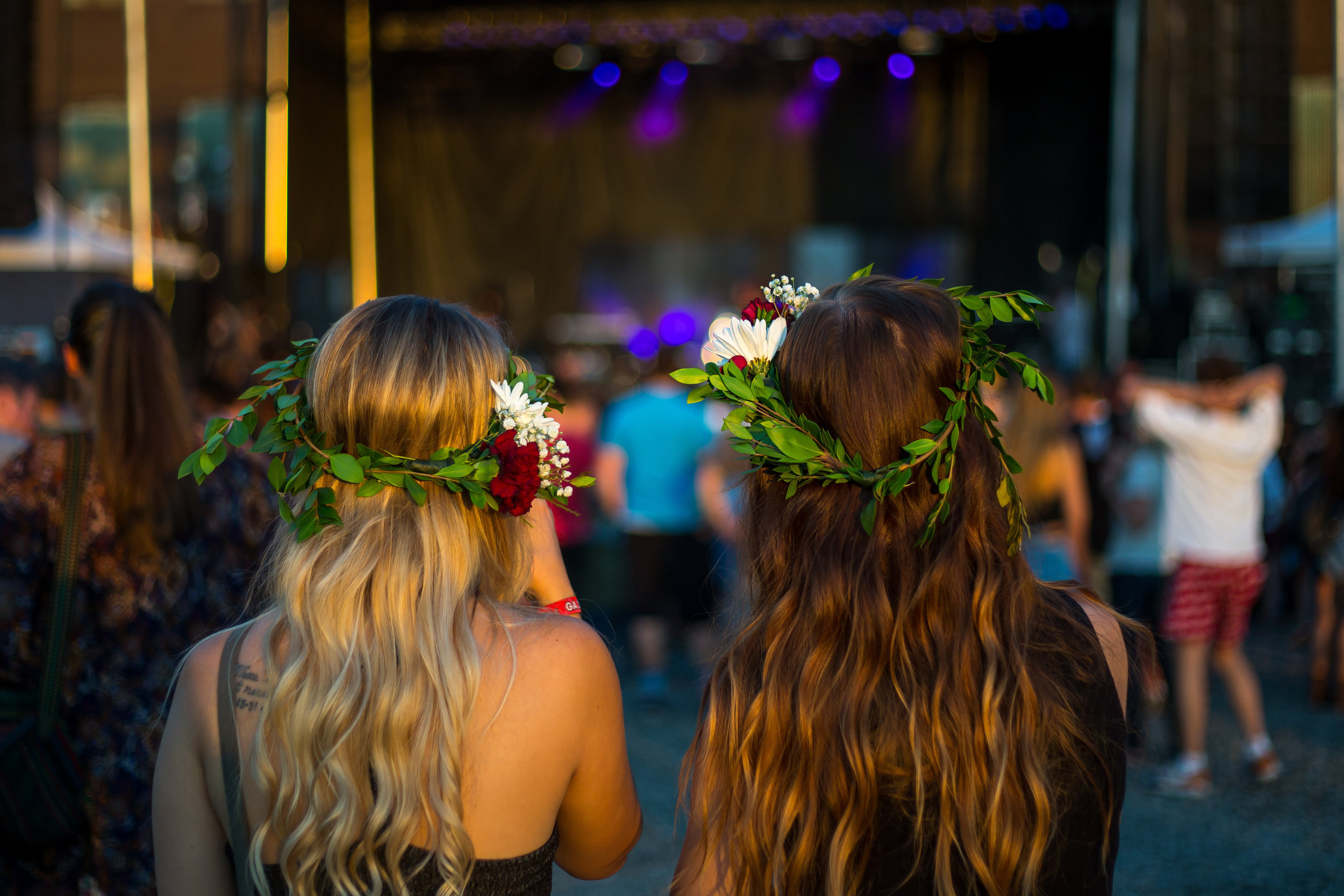  Sisters Christine, left and Gillian Mullias watch as Daya, a local singer and songwriter, preforms on stage on day one of Thrival Music Festival in Rankin on Friday evening.  