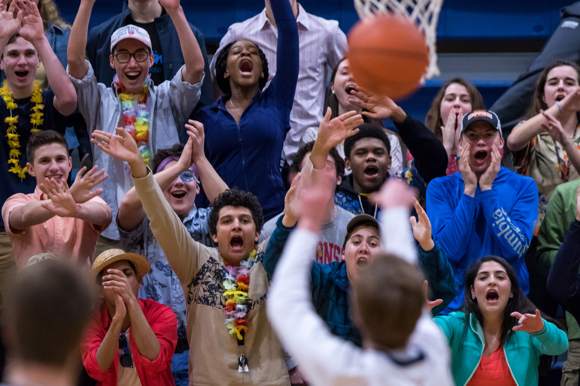  Huron students try and distract a Saline player while he shoots a free throw at Saline High School on Friday, January 20, 2017. Saline High School beat Ann Arbor Huron 42-40. Matt Weigand | The Ann Arbor News 