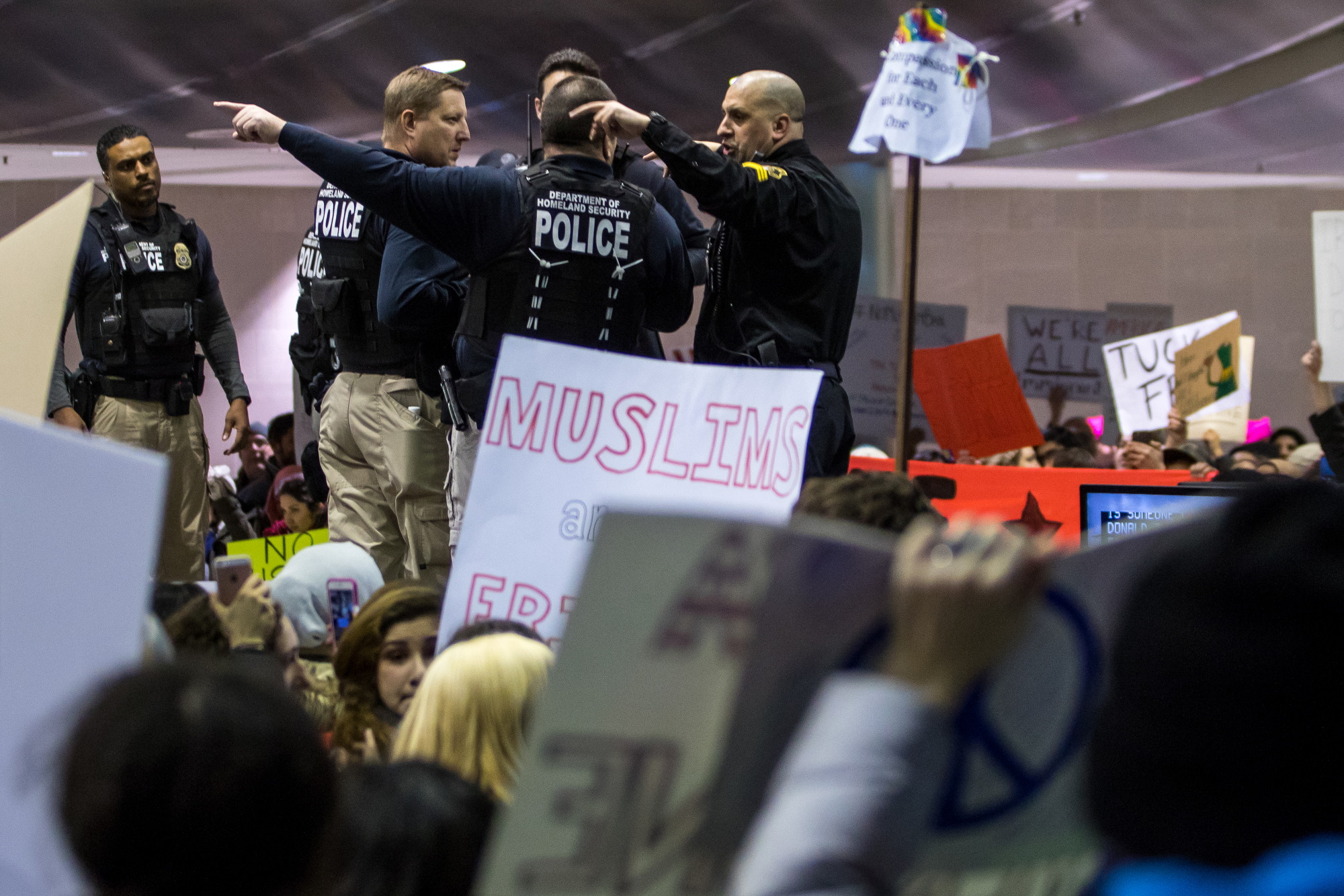  Police stand guard as thousands packed into the baggage claim at Detroit International Airport to protest President Trump and his immigration policy on Sunday, January 29, 2017. Matt Weigand | The Ann Arbor NewsMatt Weigand | The Ann Arbor News 