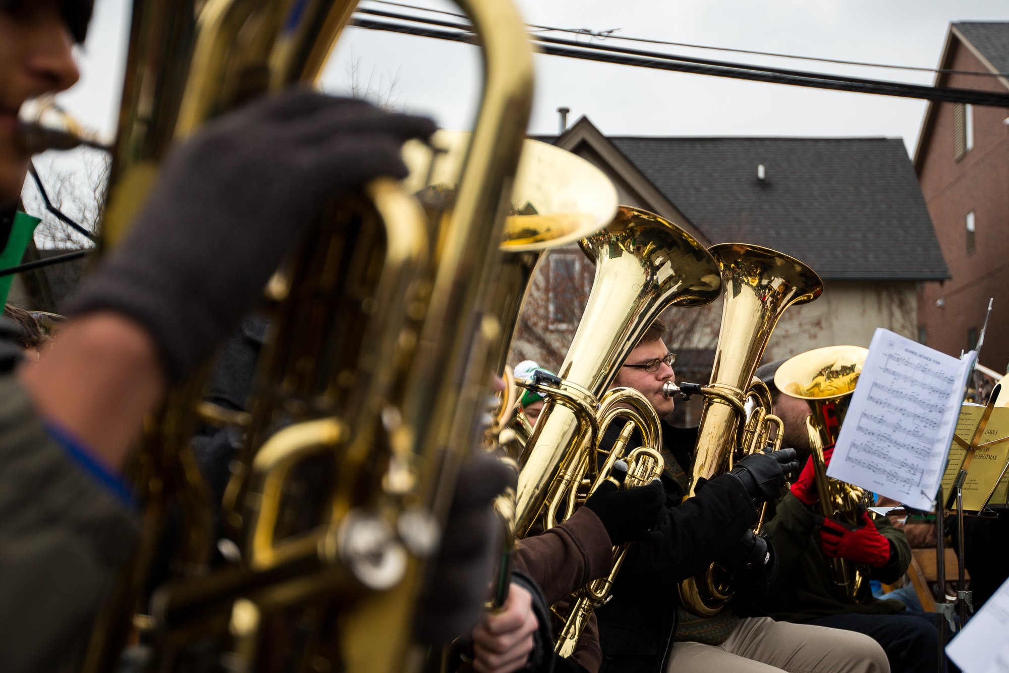  People play Christmas music during the annual Tuba Christmas event at the Ann Arbor Farmers Market in Kerrytown on Sunday, December 4, 2016. A record 62 people made up this years Tuba Christmas band, ranging from high school students, to retirees. M