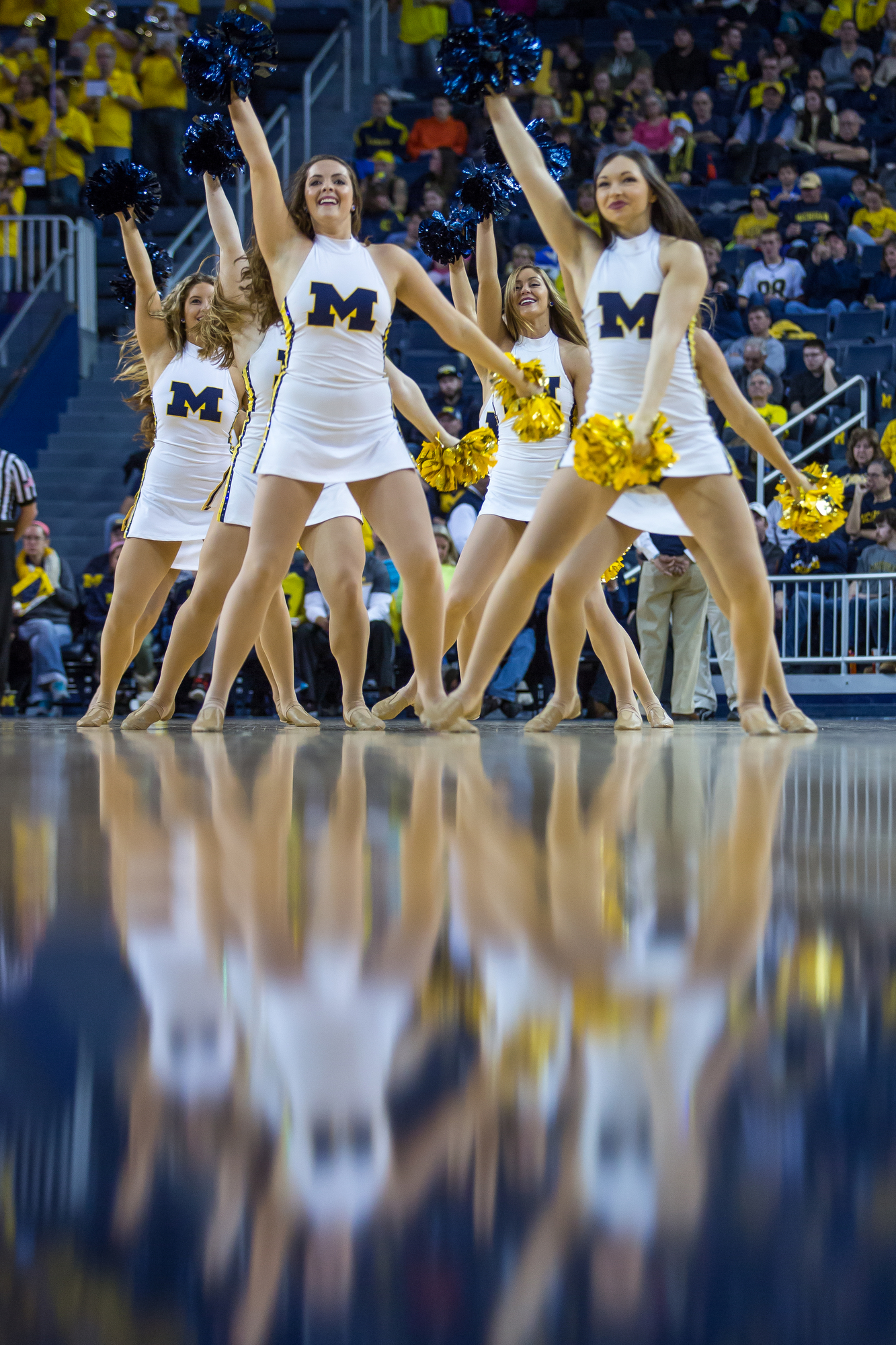  The Michigan dance team dances during a timeout during the second half of play at the Crisler Center on Saturday, December 17, 2016. The Michigan Wolverines beat the Maryland Eastern Shore Hawks 98-49. Matt Weigand | The Ann Arbor News 