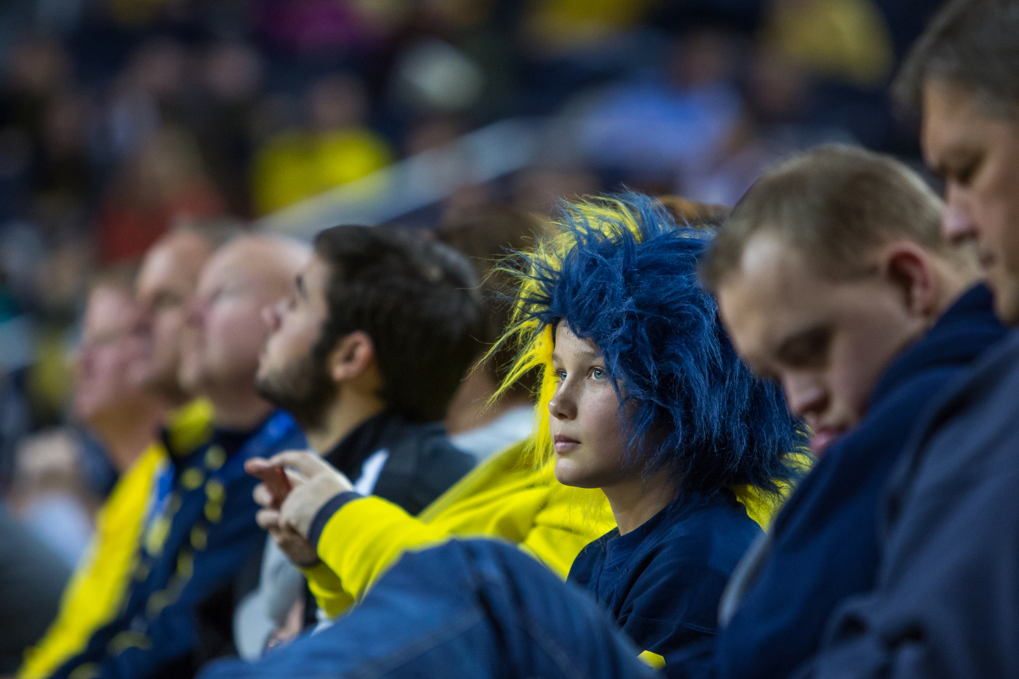  A Michigan fan watches the game during the second half of play at the Crisler Center on Saturday, December 17, 2016. The Michigan Wolverines beat the Maryland Eastern Shore Hawks 98-49. Matt Weigand | The Ann Arbor News 