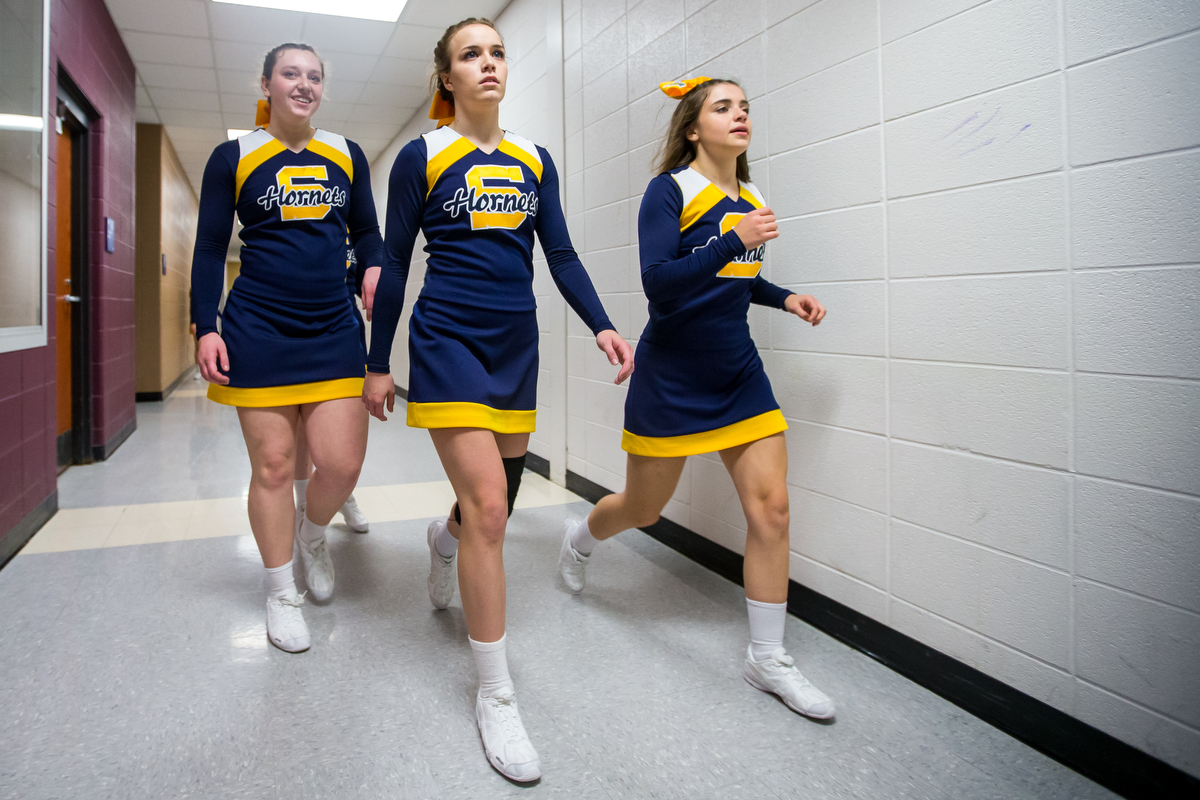  Ellie Peterson, Saline High School sophomore, center, walks with teammates after the second round of the 2017 Dexter Competitive Cheer Invitational at Dexter High School on Saturday, February 11, 2017. The Saline team got first place with an overall