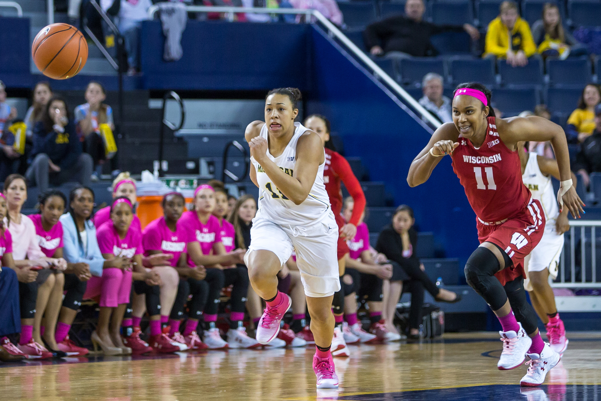  Michigan's Jillian Dunston (11), left and Wisconsin's Marsha Howard (11) run after a loose ball during the second half of play at the Crisler Center on Sunday, February 12, 2017. The Michigan Wolverines beat the Wisconsin Badgers 75-66. Matt Weigand