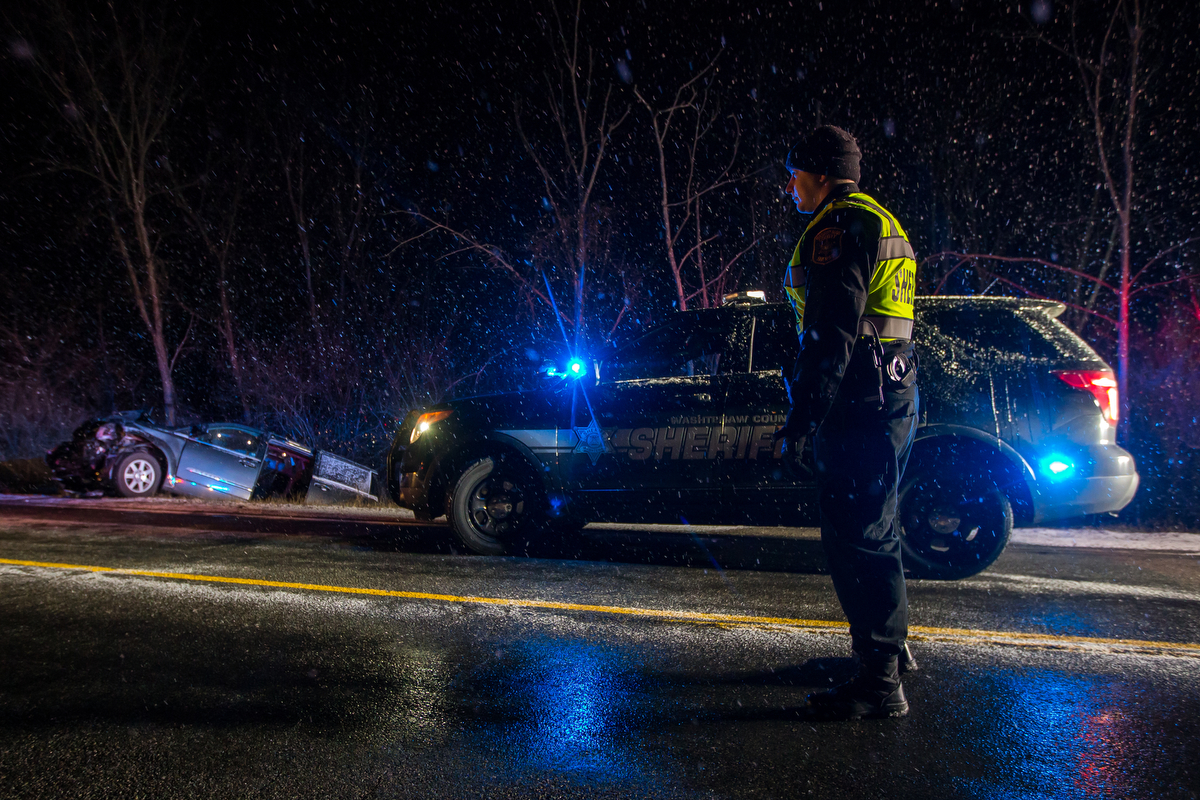  Deputy Johnny Woollams stands near a car that sits in the ditch on Prospect Road after being involved in a two car accident on Prospect Road near Cherry Hill Road on the evening of Thursday, March 2, 2017. The accident is still under investigation. 
