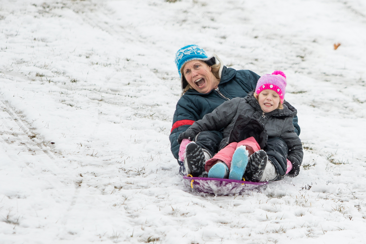  Bridgett Fleming, left and her granddaughter Maya Konars, 6, sled down a hill at Veterans Memorial Park on Saturday, March 18, 2017. A small amount of snow fell on Saturday morning, but warmer temperatures are expected throughout the week. Matt Weig