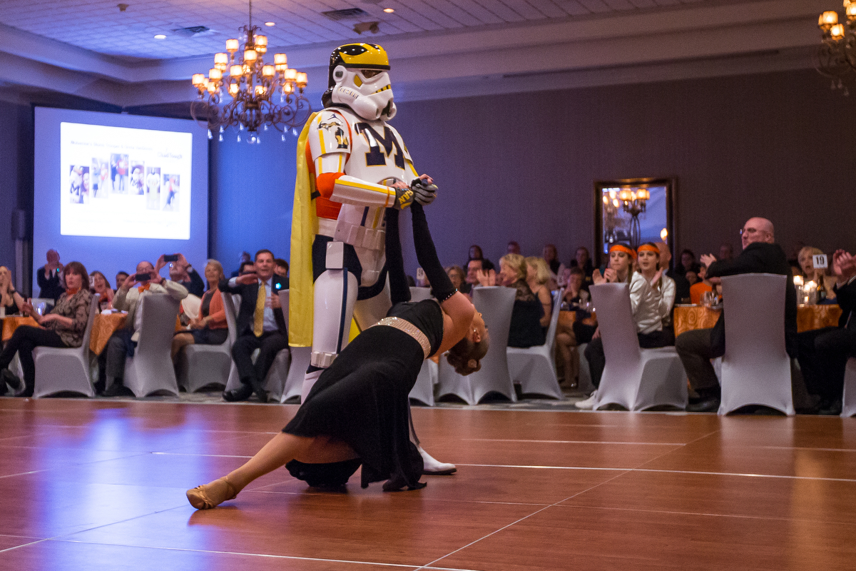  Jon Leopold, also known as the Wolverines Trooper, dances with Greta VanDoren during the dance competition during the Dancing with the Michigan Stars event at the Kensington Hotel on Thursday, March 30, 2017. All benefits of the competition proceed 