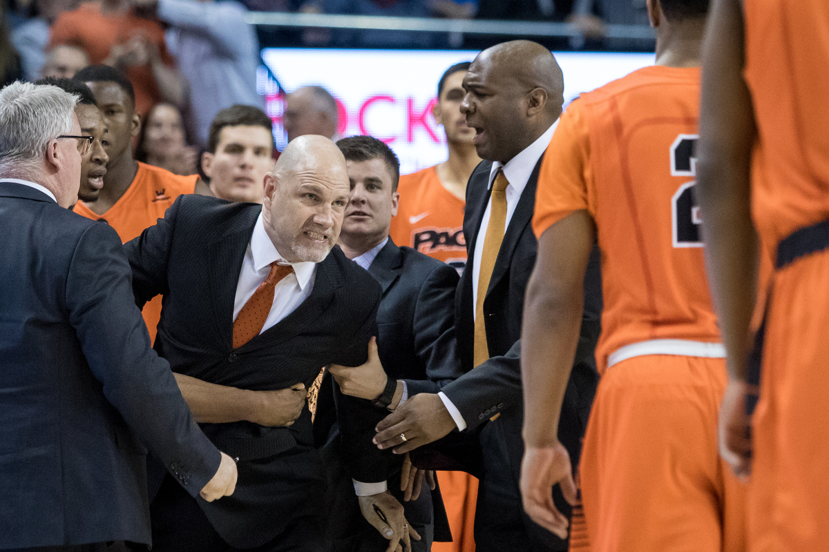  Pacific Tigers interim head coach Mike Burns is held back by members of the coaching staff and of the team as he argues with a referee. Burns was ejected form the game during the second half of play for a technical foul. The Zags went on to win 90-6
