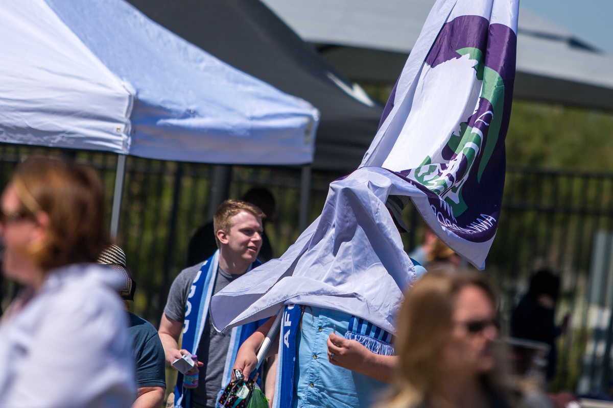  Matt Galardi's flag blows over his face as he arrives for the season opening National Premier Soccer League home opener between AFC Ann Arbor and Kalamazoo FC at Hollway Field at Pioneer High School on Sunday, May 14, 2017. Ann Arbor beat Kalamazoo 