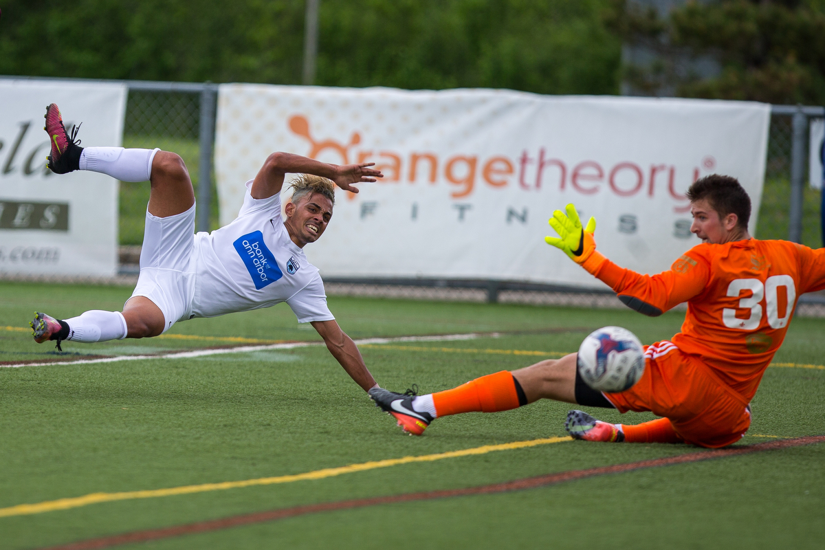  AFC Ann Arbor's Dario Suarez (7) scores a goal during the 40th minute during their matchup against Detroit City FC at Hollway Field at Pioneer High School on Sunday, May 21, 2017. AFC Ann Arbor beat Detroit City FC 2-0. Matt Weigand | The Ann Arbor 