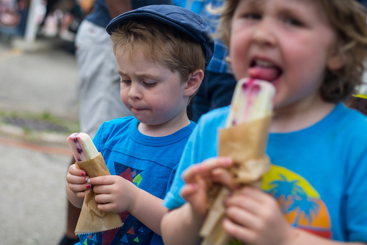 Isley Schulz, two and a half, left, eats a popsicle with his brother Julian, four and a half, during the first annual Taco Mania festival, hosted by Current Magazine and Growing Hope at the Ypsilanti Farmers Marketplace on Saturday, June 17, 2017. O